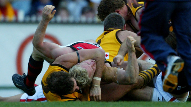 Hawthorn's Nick Holland and Essendon's Mark Johnson during the 'Line in the Sand' brawl in 2004.