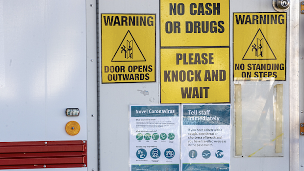 Signage cautioning against the coronavirus (COVID-19) are seen on a dental clinic van at Surfers Paradise on July 15, 2020 in Gold Coast, Australia. 