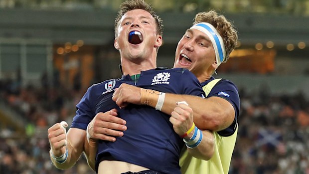 George Horne of Scotland celebrates scoring his team's seventh try