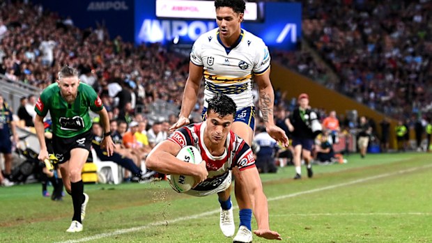 Joseph Suaalii of the Roosters goes in for a try