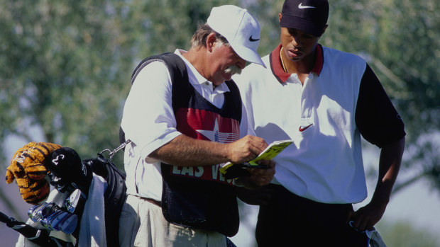 Tiger Woods with caddie Mike "Fluff" Cowan on the way to his first PGA Tour win in 1996.