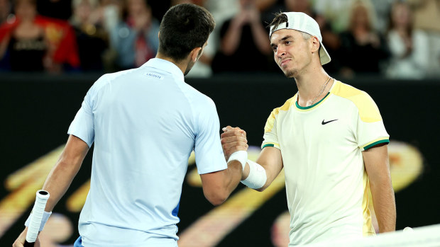 Novak Djokovic (left) greets Dino Prizmic.