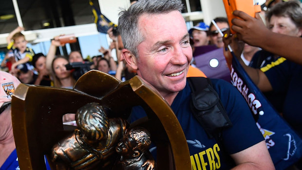  Cowboys coach Paul Green holds the NRL trophy