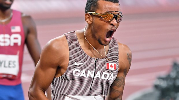 Canadas Andre de Grasse celebrates the gold medal in the 200m final at the 2020 Tokyo Olympics.