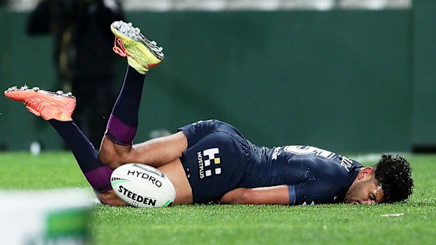 Josh Addo-Carr of the Storm injures himself after scoring a try 