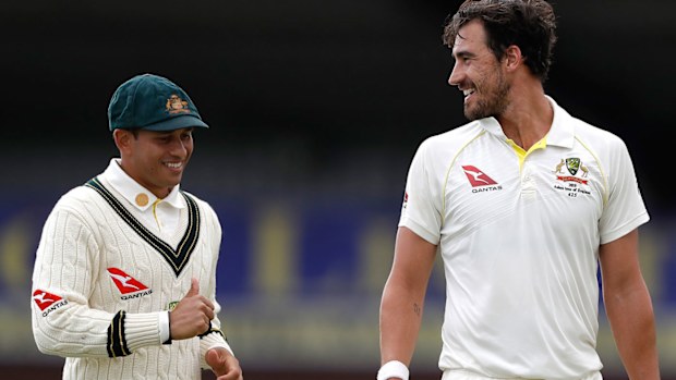 Mitchell Starc of Australia speaks to Usman Khawaja during day one of the Tour Match between Derbyshire CCC and Australia