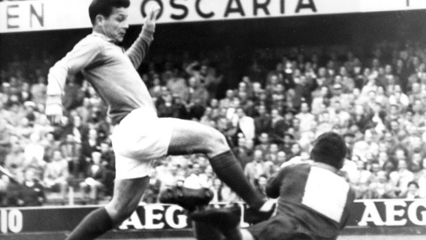 France's Just Fontaine, left, tries to go past Brazil's goalkeeper Gilmar tackles in their semifinal match in Stockholm, on June 24, 1958.