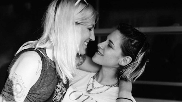 Kristen Stewart and Dylan Meyer pose in black-and-white photo.