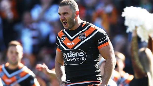 Robbie Farah leads the Tigers out 