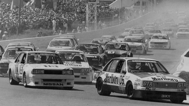 Peter Brock in the 05 Commodore leads through the first corner of the 1983 Bathurst 1000.