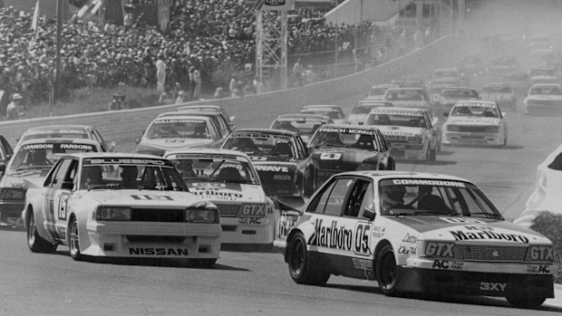 Peter Brock in the 05 Commodore leads through the first corner of the 1983 Bathurst 1000.