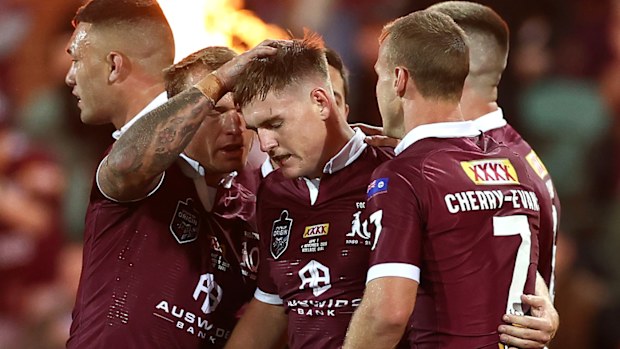 AJ Brimson of the Maroons celebrates with team mates
