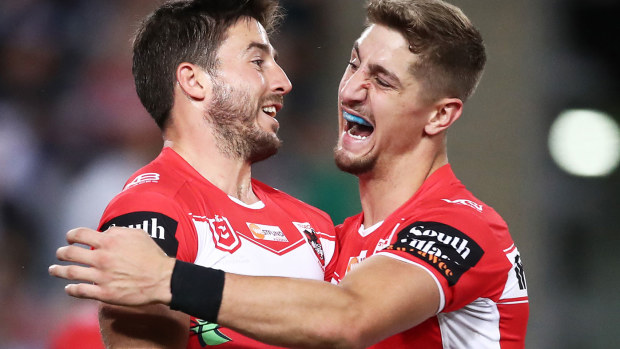 Ben Hunt of the Dragons (L) celebrates with Zac Lomax (R) after scoring a try 