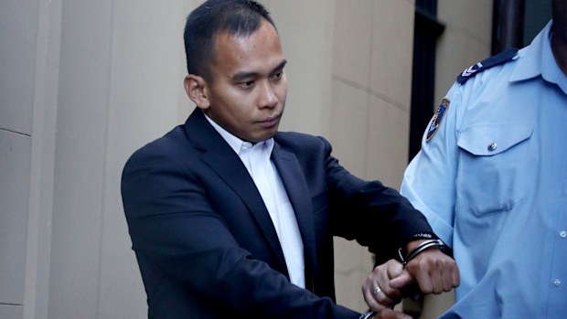 Roy Abanales Tabalbag is escorted to prison. (AAP)