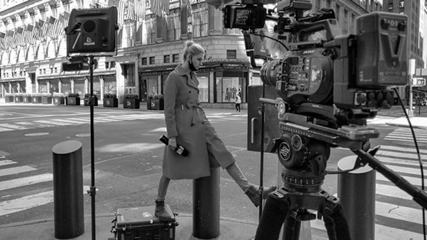 Adams, wearing a mask, waits for her cue in New York City.