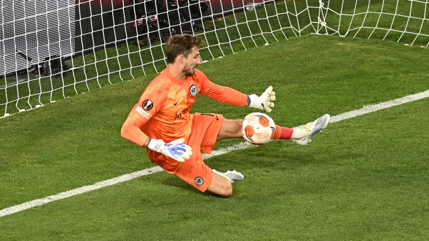 Kevin Trapp of Eintracht Frankfurt saves a penalty from Aaron Ramsey of Rangers in the Europa League final.