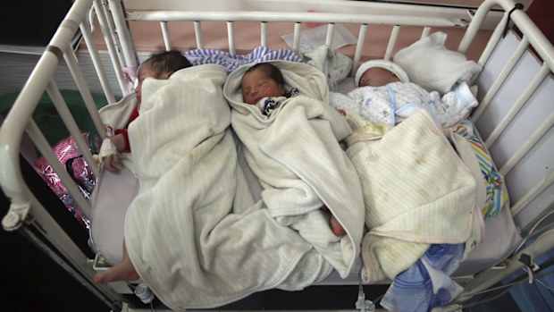 Newborn babies were rushed by police, soldiers and hospital staff to another hospital in Kabul.