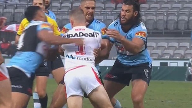 Jesse Ramien hits Matt Dufty with a swinging arm in the round one clash between the Dragons and Sharks.