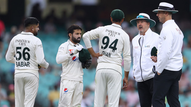 Shan Masood of Pakistan speaks with the umpires as play is suspended due to bad light during day two of the Men's Third Test Match in the series between Australia and Pakistan at Sydney Cricket Ground on January 04, 2024 in Sydney, Australia. (Photo by Jason McCawley - CA/Cricket Australia via Getty Images)
