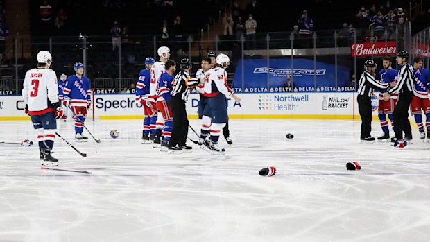 The New York Rangers and the Washington Capitals fight off the first face-off at Madison Square Garden on May 5, 2021 in New York City.