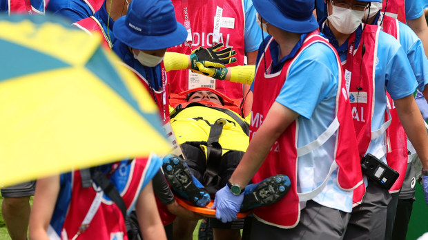 Saya Sakakibara is carried in a stretcher after her accident at the Tokyo Olympics 