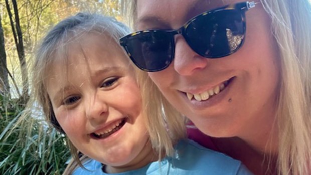Ashlee Law poses for a selfie with her daughter. Both are blonde and smiling.