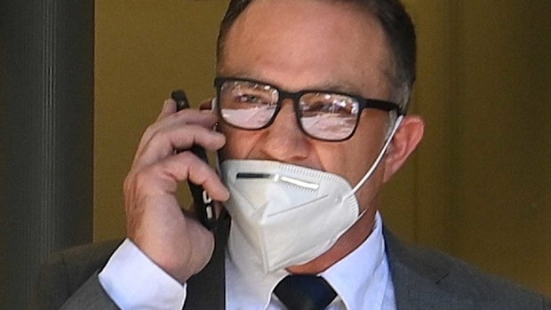 Michael Slater has been charged with assaulting a man at a Sydney hospital.