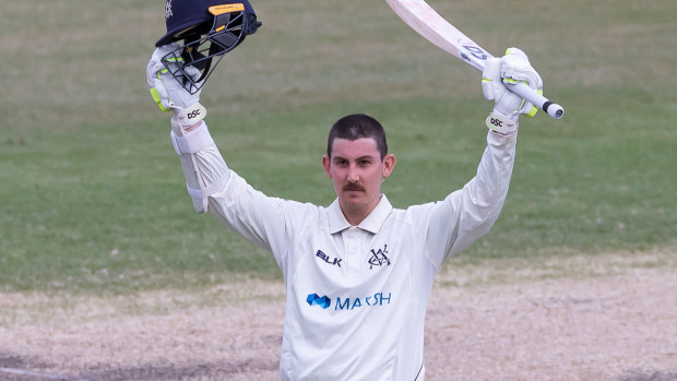 Nic Maddinson celebrates his century against New South Wales.