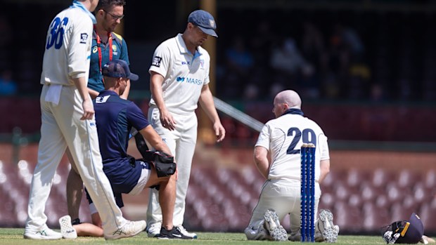Travis Dean of Victoria retires hurt during the Marsh Sheffield Shield match between the NSW Blues and Victoria