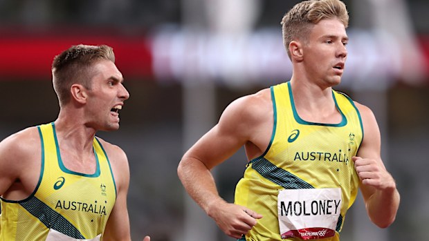 Cedric Dubler of Australia encourages his team mate and bronze medalist Ashley Moloney 