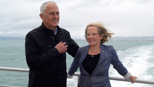 Australian Prime Minister Malcolm Turnbull and his wife Lucy pose for photographs in front of Magnetic Island near Townsville. (AAP)