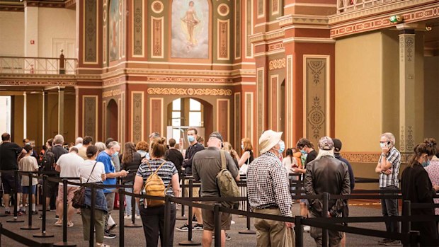 People in line to recieve their Covid-19 booster shot at the St Vincents Vaccination hub at the Royal Exhibition Building, Carlton. 