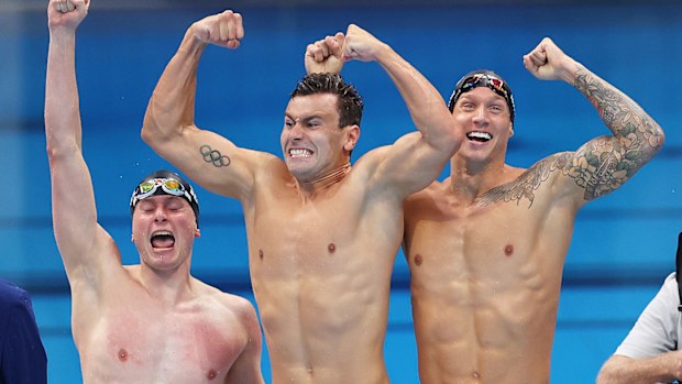 Bowen Becker, Blake Pieroni and Caeleb Dressel of Team United States celebrate after winning the gold medal in the Men's 4 x 100m Freestyle Relay Final on day three of the Tokyo 2020 Olympic Games at Tokyo Aquatics Centre on July 26, 2021 in Tokyo, Japan. (Photo by Davis Ramos/Getty Images)