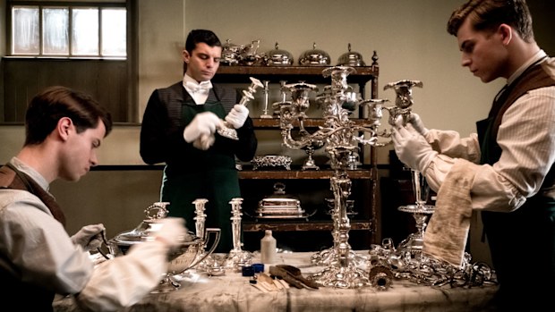 Downton Abbey the movie - valets polishing silver in the house 