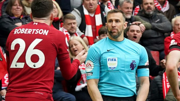 Liverpool's Andrew Robertson appeals to assistant referee Constantine Hatzidakis.