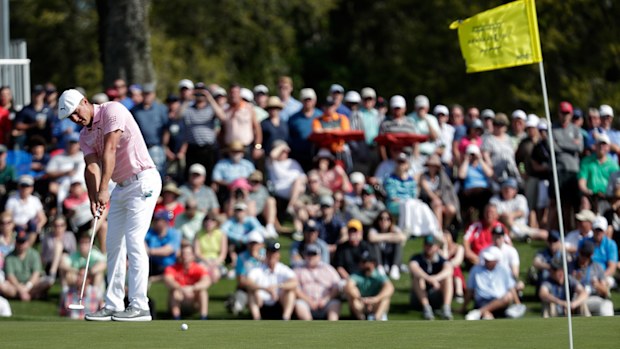 Bryson DeChambeau putts on the 17th green during the first round of The Players Championship