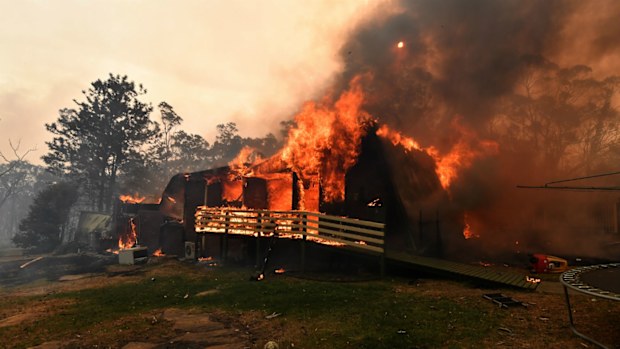 A home lost to a bushfire on Hassall Road in Buxton, near where the two firefighters were killed.