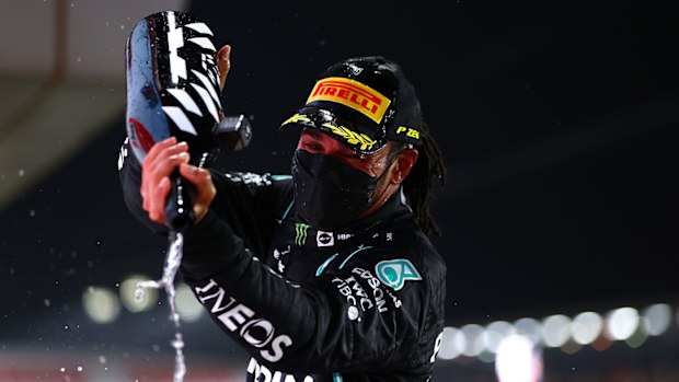 Lewis Hamilton of Great Britain and Mercedes GP celebrates on the podium