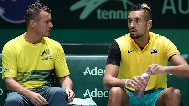 Team Captain Lleyton Hewitt speaks with Nick Kyrgios of Australia