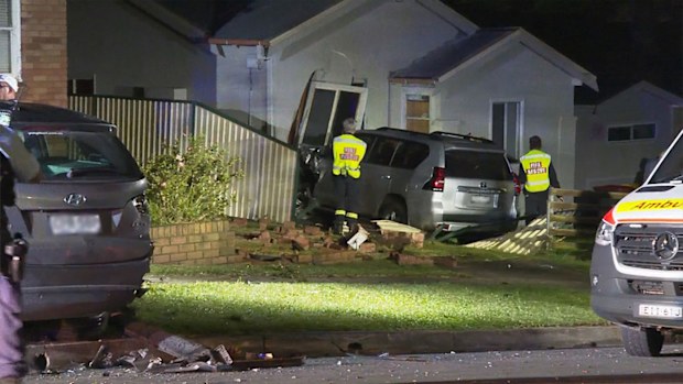 Car crashes into side of Guildford home where woman was sleeping.