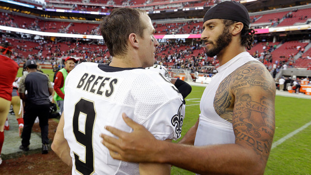 In this Nov. 6, 2016, file photo, San Francisco 49ers quarterback Colin Kaepernick, right, is greeted by New Orleans Saints quarterback Drew Brees at the end of an NFL football game.