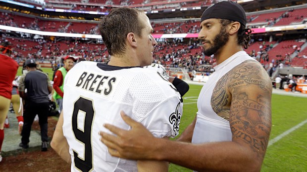 In this Nov. 6, 2016, file photo, San Francisco 49ers quarterback Colin Kaepernick, right, is greeted by New Orleans Saints quarterback Drew Brees at the end of an NFL football game.