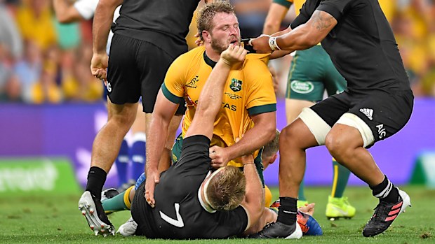 James Slipper of the Wallabies is punched by Sam Cane