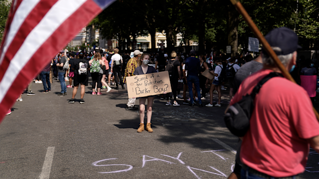 Demonstrators protest, Thursday, June 4, 2020, near the White House in Washington, over the death of George Floyd. (AP Photo/Evan Vucci)