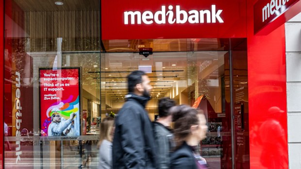 People walk past a Medibank outlet in Sydney.