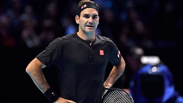  Roger Federer of Switzerland reacts as he questions a line call