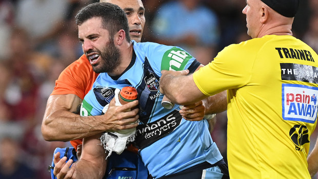 James Tedesco of the Blues is seen after he collided with Papalii's knee