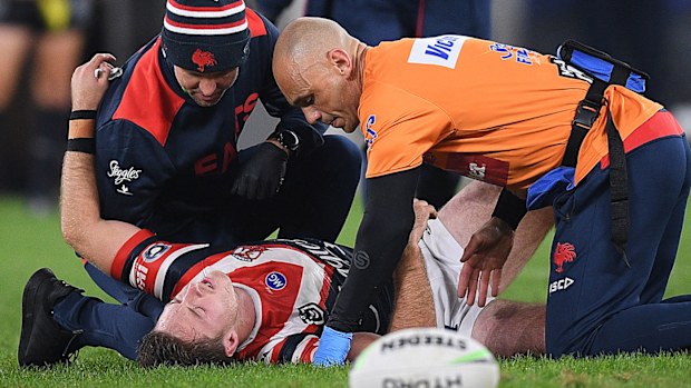 Sam Verrills receives treatment after rupturing his ACL.