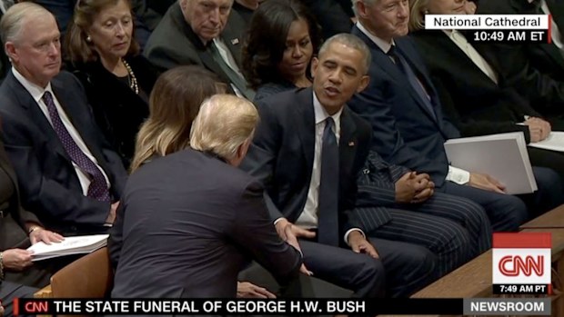 Former President Barack Obama greets President Donald Trump.