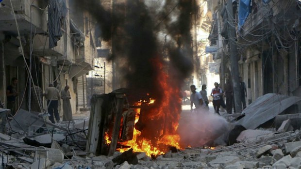 Syrians inspect damaged buildings after airstrikes by government helicopters on the rebel-held Aleppo neighbourhood of Mashhad. (AAP)